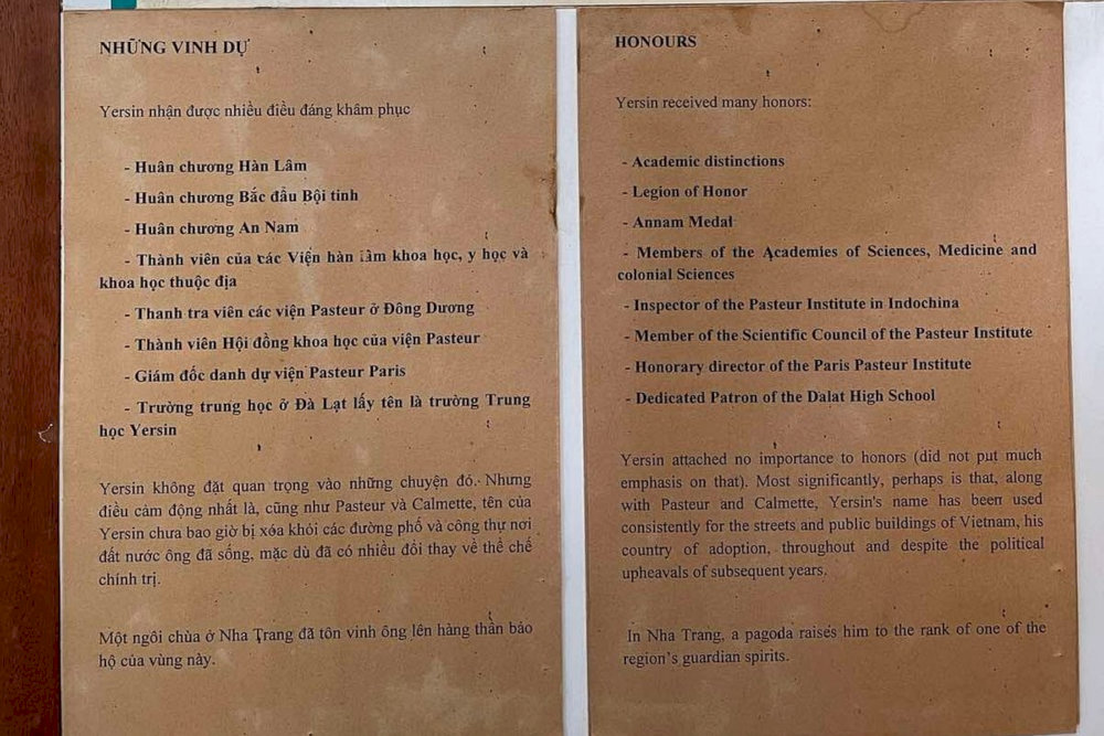 A bilingual display listing Alexandre Yersin’s numerous honors and his lasting legacy in Vietnam